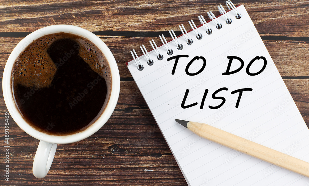 Poster to do list text on notebook with coffee on wooden background