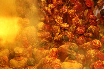 People throw colours to each other during the Holi celebration in Uttar Pradesh, India. Holi is the...