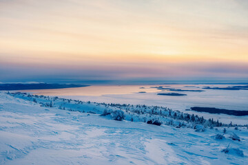 Fototapeta na wymiar Beautiful Arctic sunset. Scenic colorful sky at dawn. Aerial view of sunrise bright sky. Top View from high altitude.