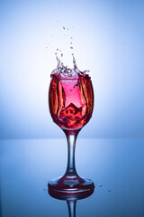 red wine pouring into glass