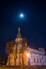 Grodno. Belarus. Orthodox church against the backdrop of the night sky and the full moon.