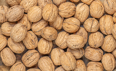 Walnuts Background. Fresh walnuts  as a wallpaper, poster
