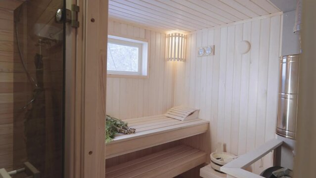 Wooden bath. Steam room in a traditional sauna.