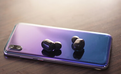 smartphone with wireless earphone for listening the music anywhere