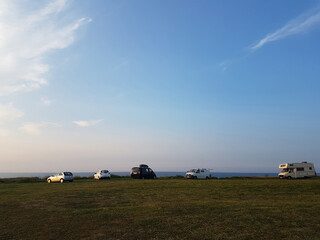 Cars and caravans next to the sea