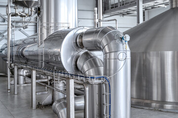 Thick insulated piping, stainless steel water pipes. Food factory