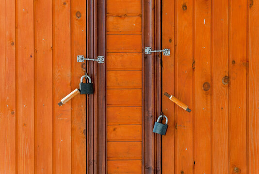 Two Doors With Two Handles And Two Locks