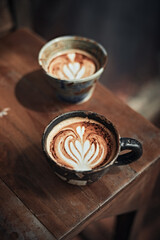 Selective focus cup of hot latte art coffee
