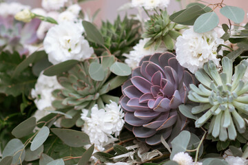 Main table at a wedding reception with beautiful fresh flowers