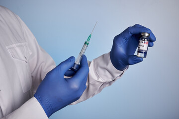 Doctor prepares American covid vaccine shot. Medic guy with coronavirus inoculation phial from USA...