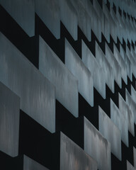 A vertical black and white image with rectangular and zigzag figures
