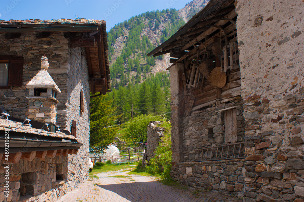 Sticker A beautiful green landscape with a traditional houses in Aosta, Italy