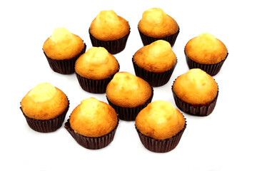 Group of small yogurt muffins on white background