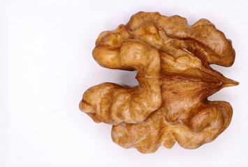 Peeled walnut with high magnification on white background
