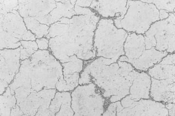 Cracks on white concrete surface cracked weathered cement worn texture broken abstract damaged pattern background