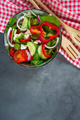 greek salad on grey stone surface