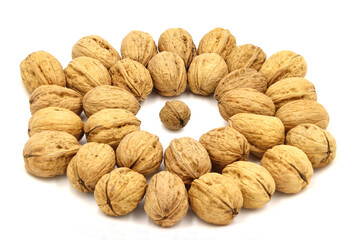 Large walnuts surrounding a small one