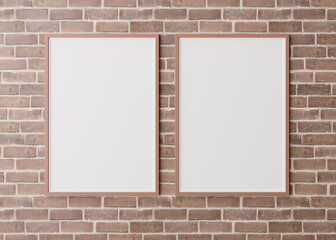 Two blank vertical picture frames hanging on brown brick wall. Template, mock up for your picture or poster. Copy space. 3D rendering.