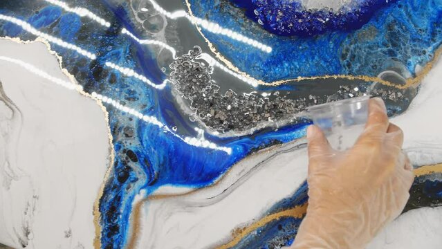 Adding texture to an epoxy resin painting