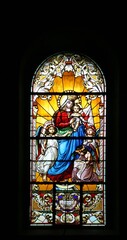 Virgin Mary with baby Jesus and Angels, stained glass window in the Saint John the Baptist church in Zagreb, Croatia