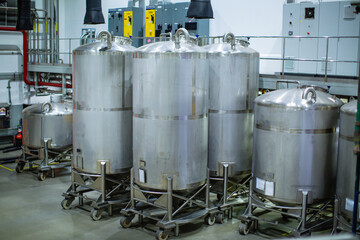 Stainless vertical steel tanks with equipment tank chemical cellar at the with scrolling wheel stainless steel tanks cleaning and mixing at control room