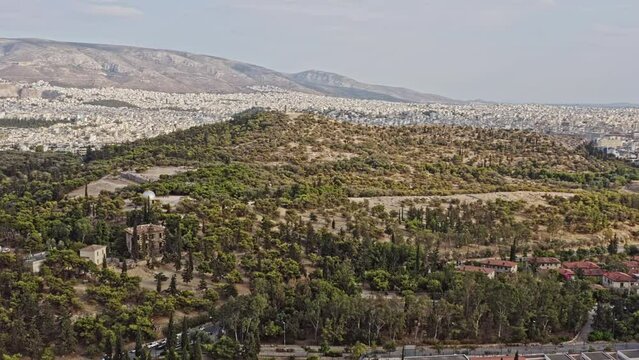 Athens Greece Aerial v5 low level drone fly around filopappou neighborhood, capturing the panoramic view of areopagus hill and acropolis downtown cityscape and landscape - September 2021
