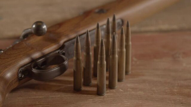 Dolly of 8mm cartridges in front of WW2 era Mauser K98