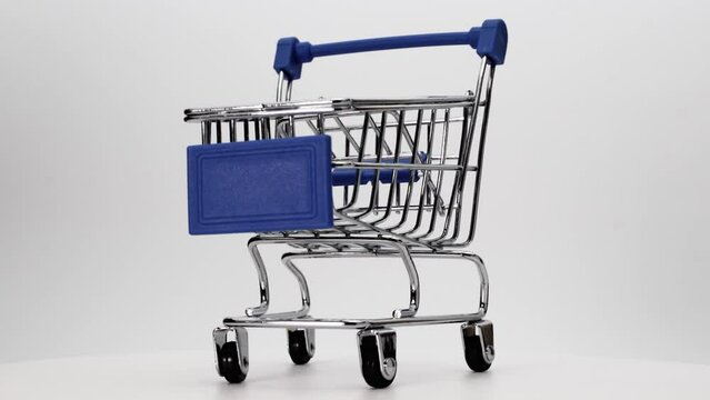 Empty shopping cart or shopping cart on a white background. The concept of trading and buying food. Close-up.