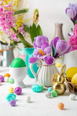 Spring flowers and golden Easter bunny colour eggs