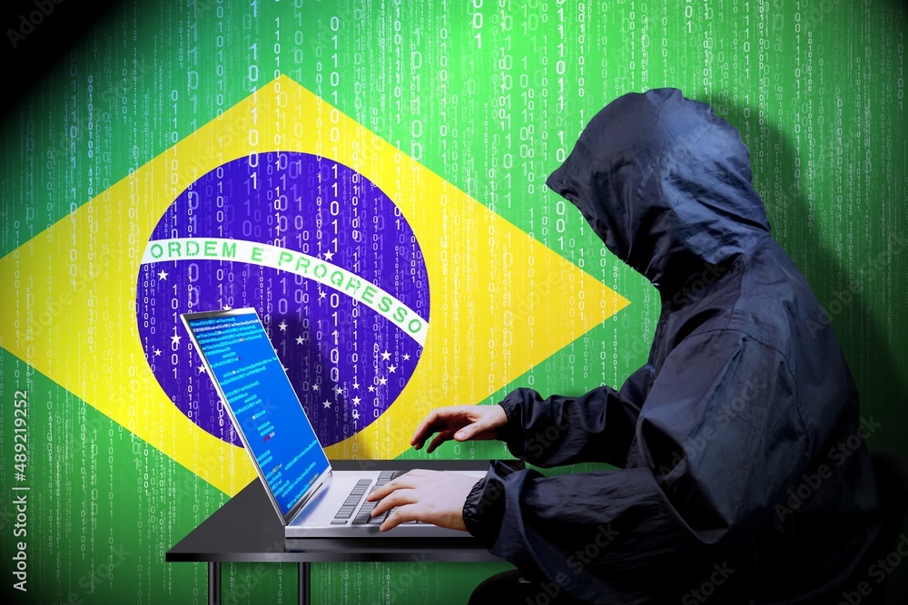 Poster anonymous hooded hacker, flag of brazil, binary code - cyber attack concept