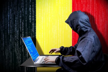 Anonymous hooded hacker, flag of Belgium, binary code - cyber attack concept