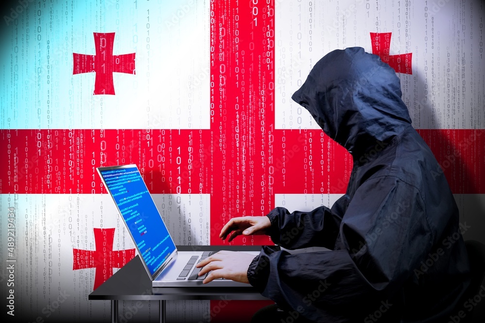 Poster anonymous hooded hacker, flag of georgia, binary code - cyber attack concept