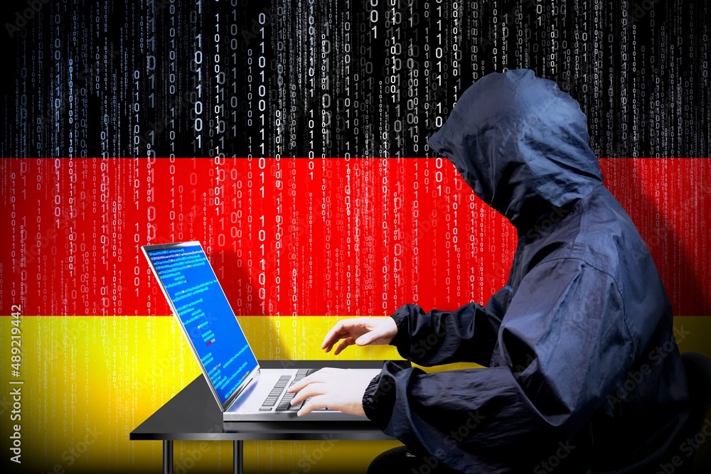 Poster anonymous hooded hacker, flag of germany, binary code - cyber attack concept