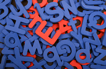 Closeup view of English alphabets in red and blue colors