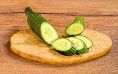 Sliced cucumber on a wooden board