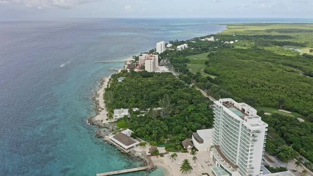 Cozumel Mexico Aerial v21 establishing shot drone flying along the island shoreline over beachfront holiday hotels, resorts and golf course with beautiful seascape - September 2020