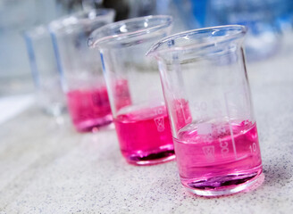colorful liquids in chemical flasks