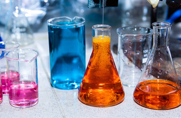 colorful liquids in chemical flasks