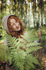 Red-haired girl enjoying nature
