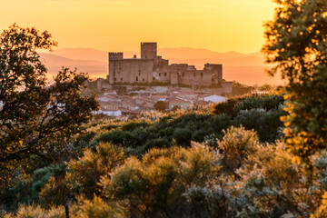 Ancient castle on old town under sundown sky