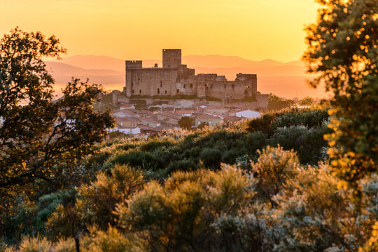 Ancient castle on old town under sundown sky