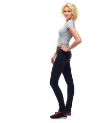 Young and confident. Full-length studio shot of a beautiful young woman standing isolated on white.