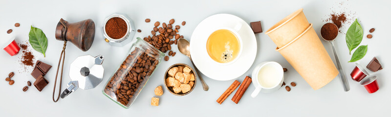 Coffee composition with coffee and accessories on white background, flat lay