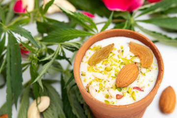 Special Indian Beverage Called Shahi Bhaang Thandai is Cannabis Infused Cooling Drink Made Of Bhang, Milk, Soaked In Dry Fruits Like Almonds Badam Pista Aniseed Rose Petals