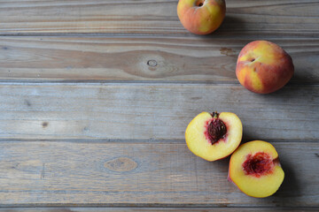 fresh peaches on wooden background