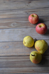 fresh apples and pears on wooden background