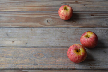 fresh apples on wooden background