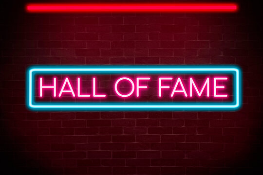 Hall of Fame neon banner on brick wall background.