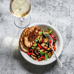 Baked ratatouille, grilled bread and glass of wine - delicious vegetarian appetizers, lunch, snack...