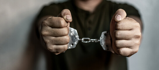 prisoner concept,Handcuffed hands of a prisoner in prison, Male prisoners were severely strained in...